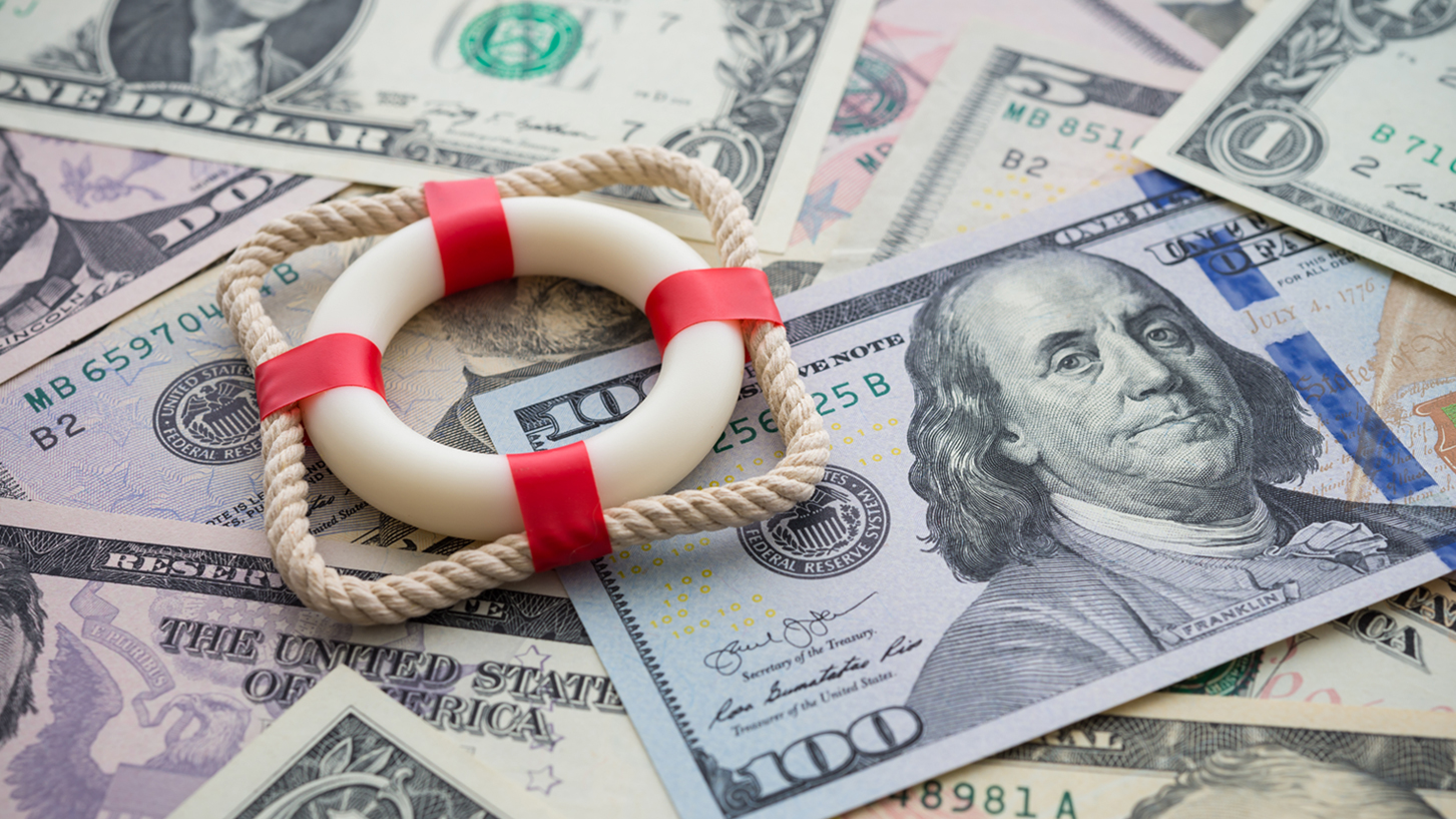6.1-photo-lifebelt-on-us-dollar-paper-banknote-bill-background-concept-of-fix-economy-financial-crisis-in-1382030159