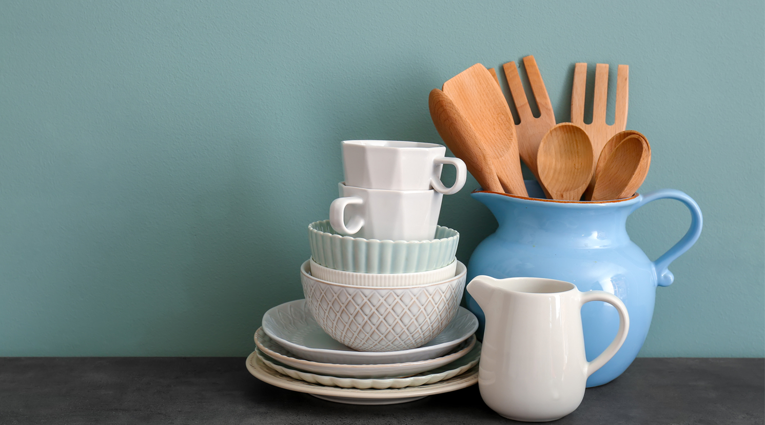 7.1-A-set-of-cooking-utensils-and-dishware-on-table